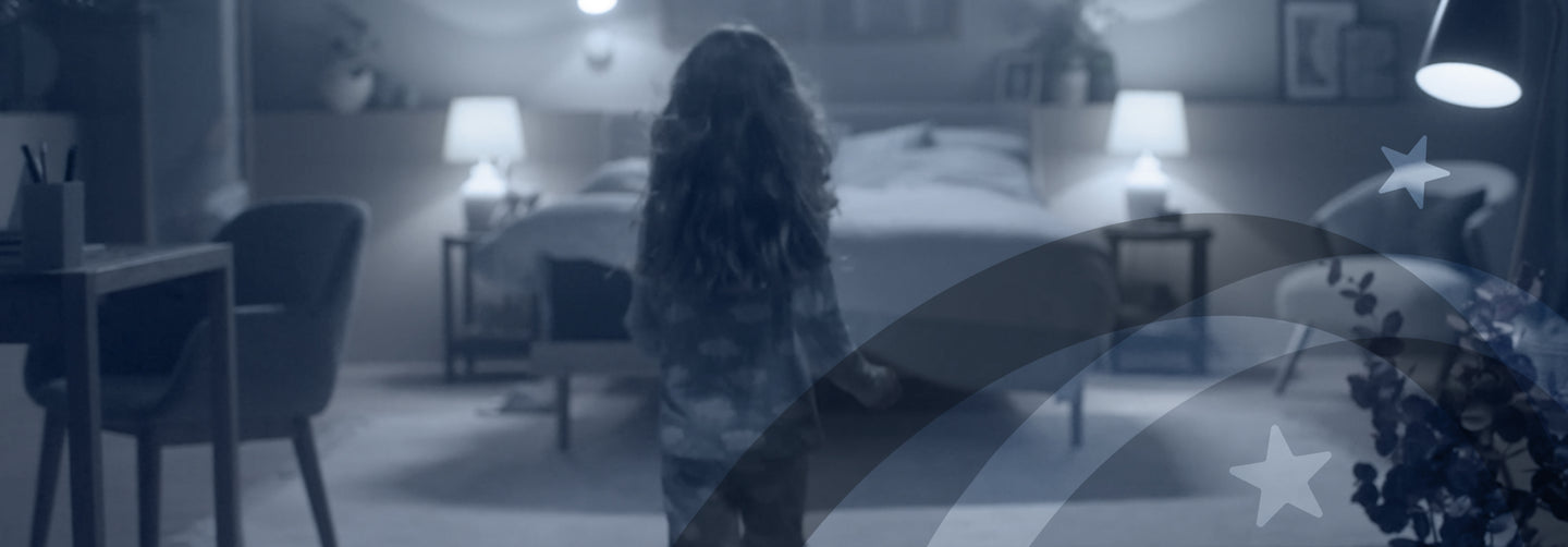 Young girl walking towards a Serta mattress in a bedroom