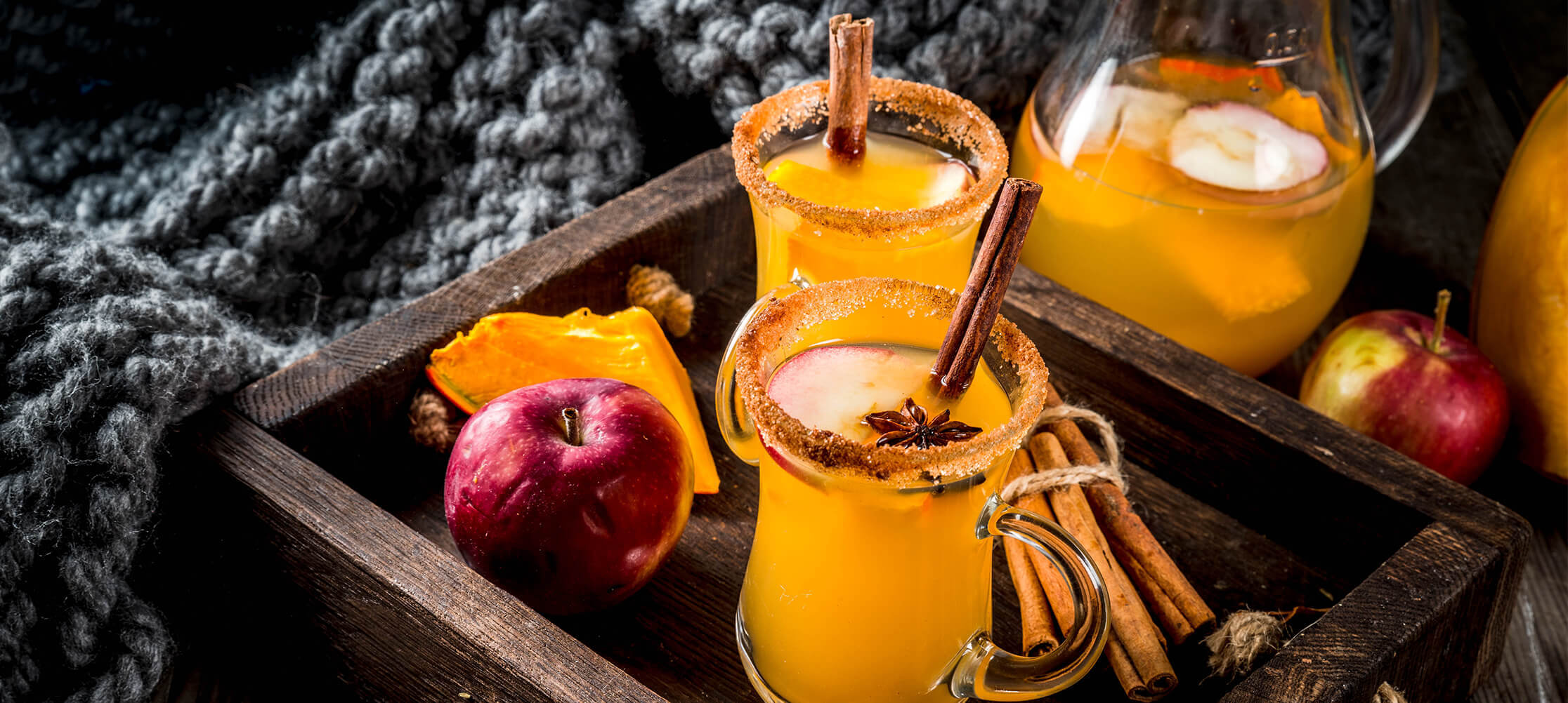 Autumn spiced apple cider in rustic setting