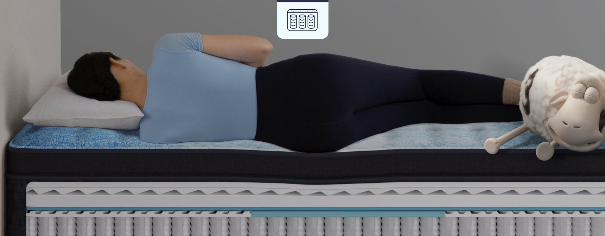 Person sleeping on layered mattress
