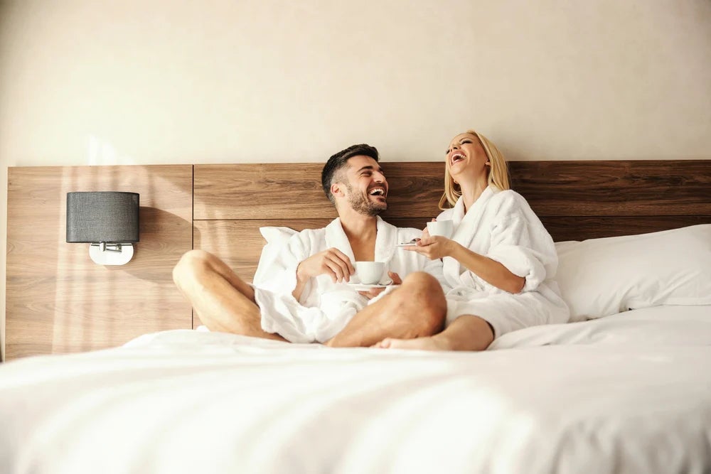 Couple Relaxing in Hotel Room