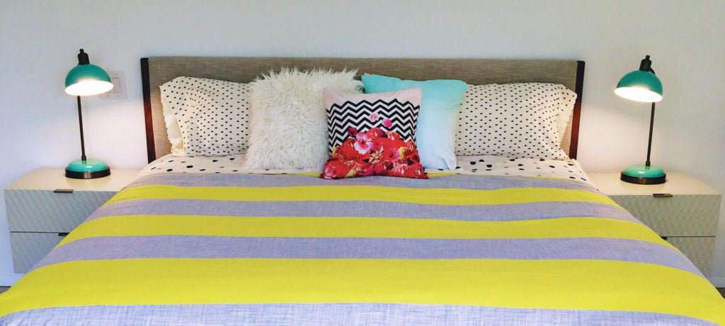 Colorful modern bedroom with striped bedding