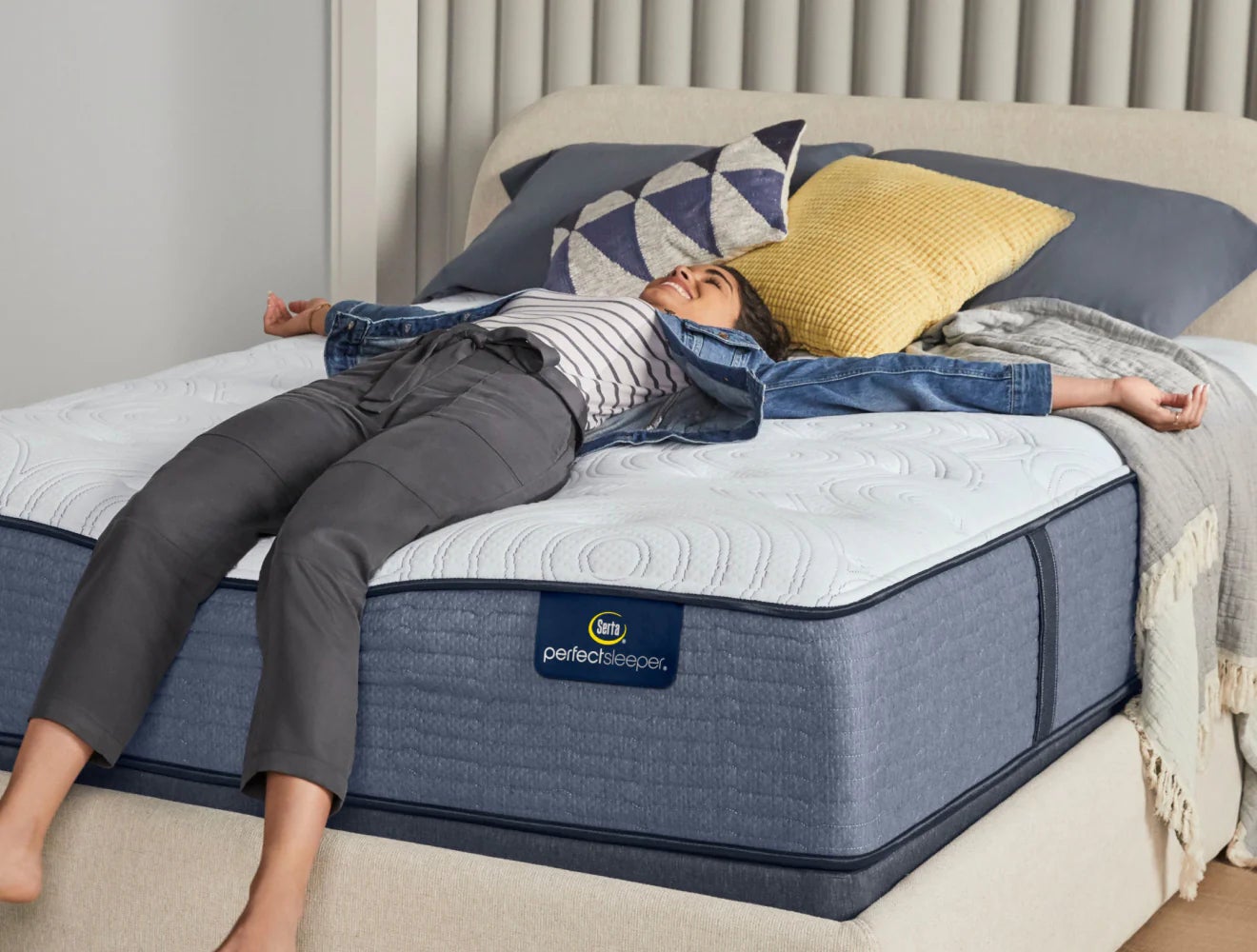 Woman relaxing on Serta Perfect Sleeper mattress