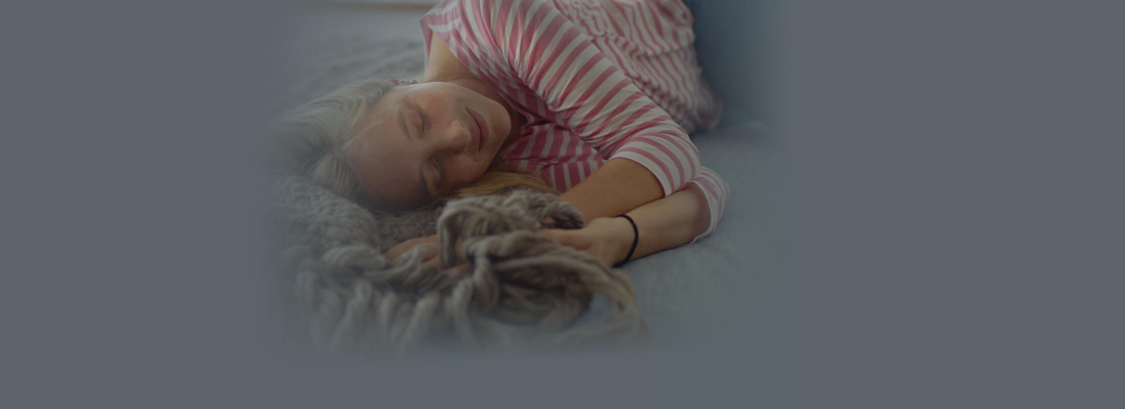 Young woman resting on cozy bed