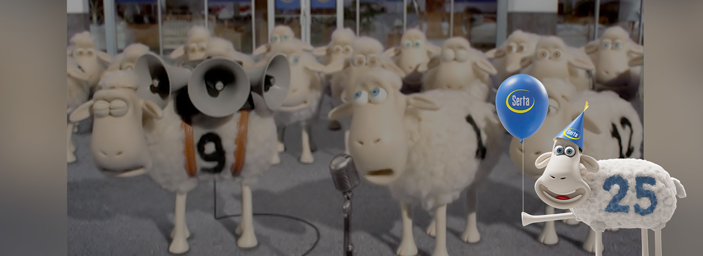 the serta birthday sheep holding a balloon