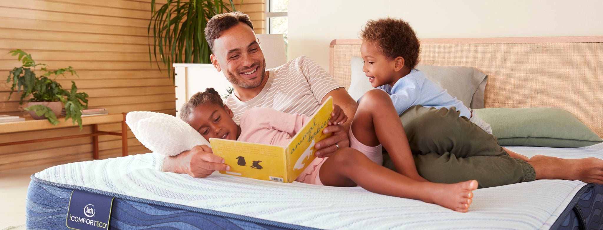 Family reading on comfortable mattress