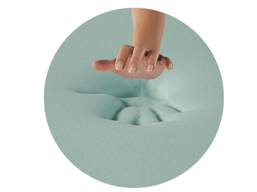 Hand pressing into soft memory foam