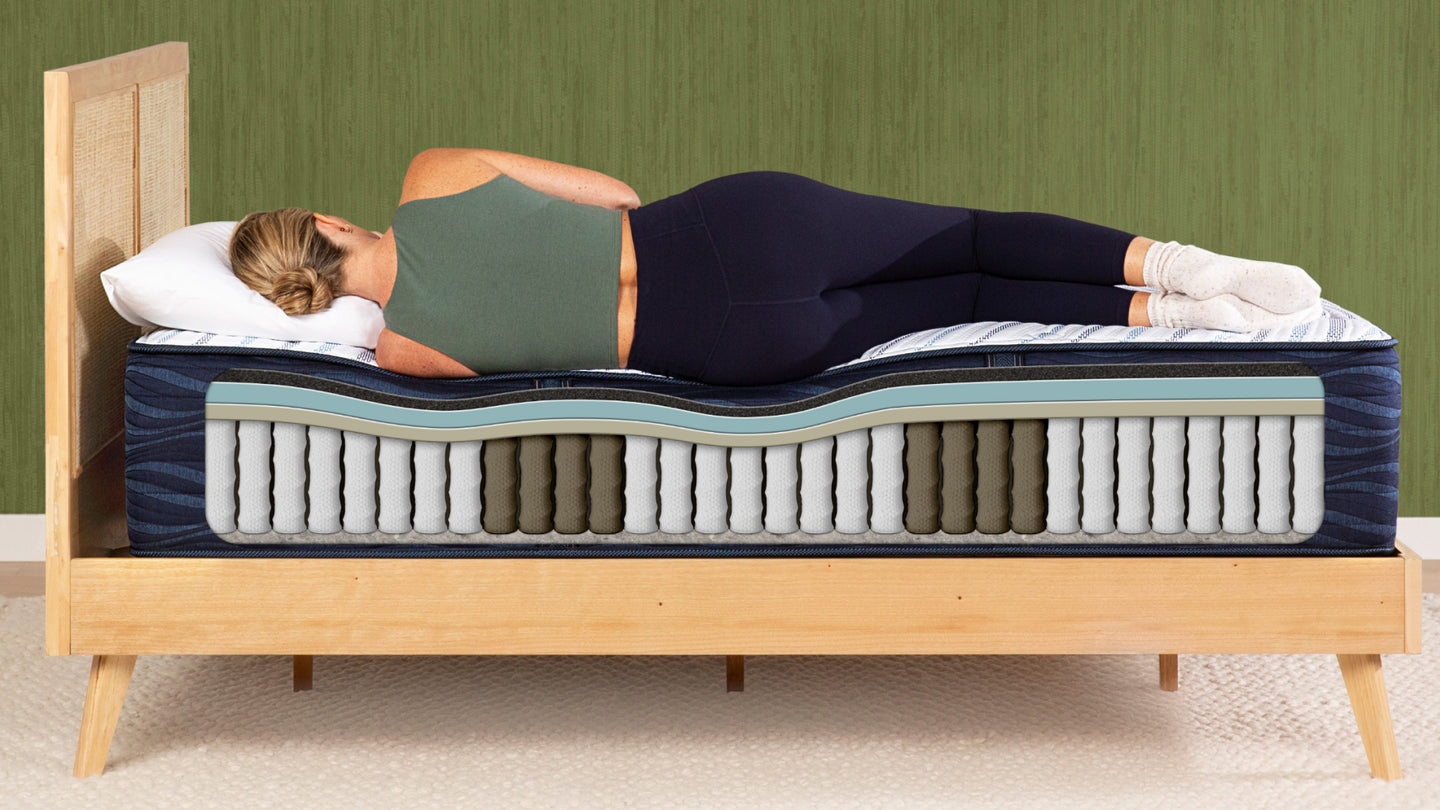 A woman sleeping on her side on a Serta mattress