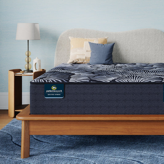 Perfect Sleeper X Quilted Hybrid Knox Plush Mattress sitting in a brown bedframe || feel: Plush || level: Level 1