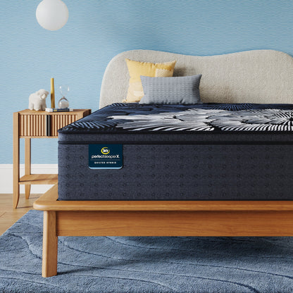 Perfect Sleeper X Quilted Hybrid Max Plush Pillow Top Mattress sitting in a brown bedframe || feel: Plush Pillow Top || level: Level 2