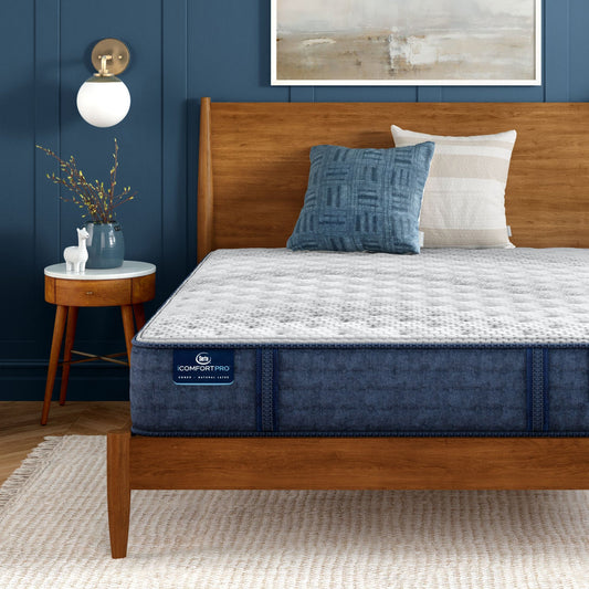 iComfortPro Granby Extra Firm Mattress sitting in a brown bedframe || feel: extra firm || level: Level 1
