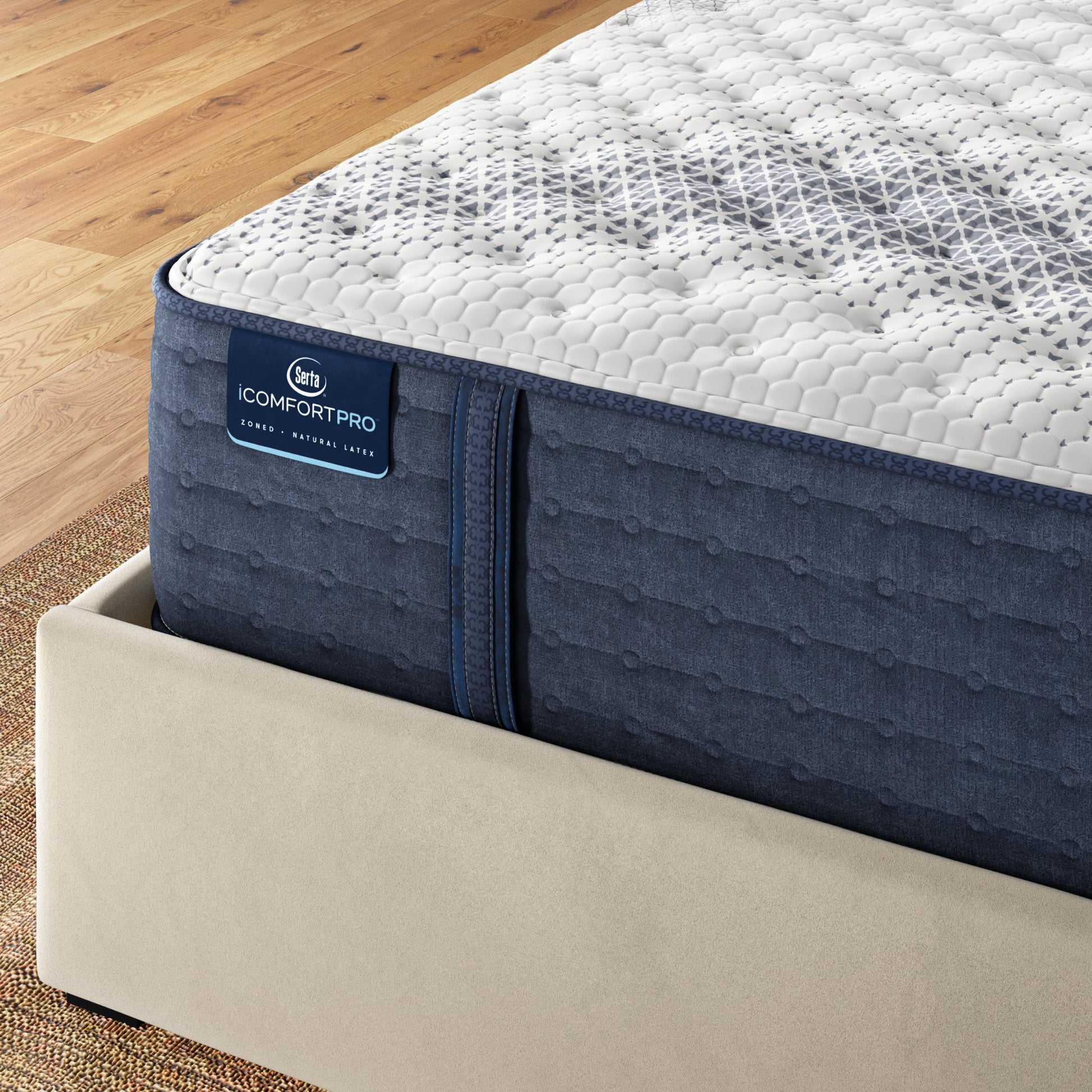 Corner of iComfortPro Kingston Firm Mattress sitting in a brown bedframe || feel: Firm || level: Level 3