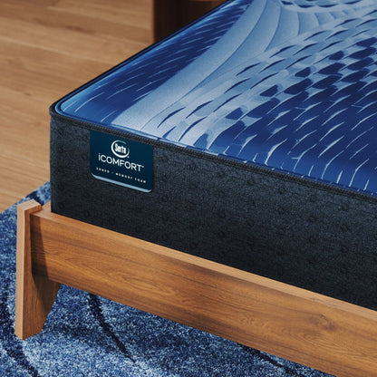 Corner of a iComfort Aspire Medium Mattress sitting in a brown bedframe || feel: medium || level: Enhanced - 14"