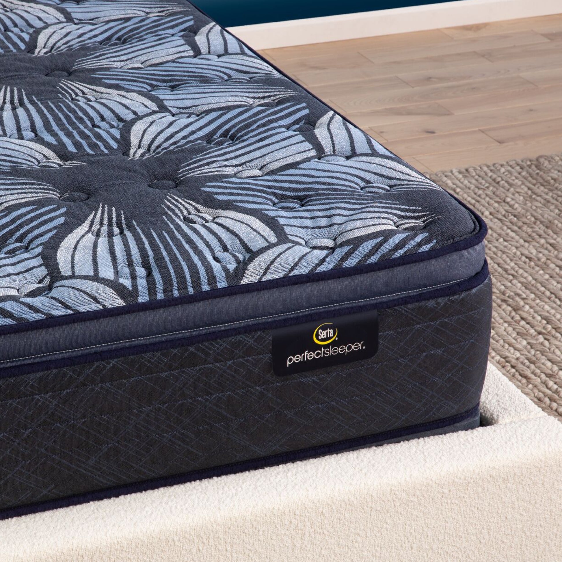 Corner view of the Serta Perfect Sleeper Sleep Excellence mattress in a bedroom | feel: medium pillow top