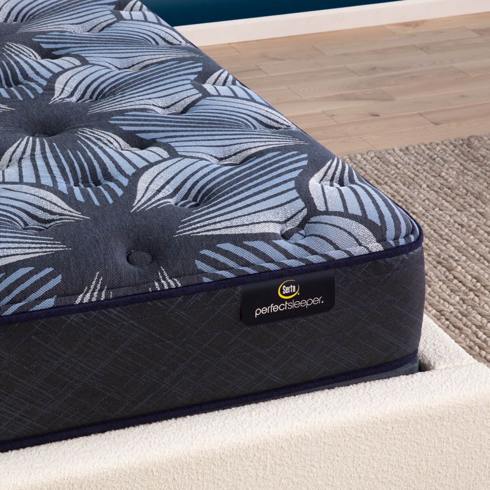 Corner view of the Serta Perfect Sleeper Sleep Excellence mattress in a bedroom | feel: plush