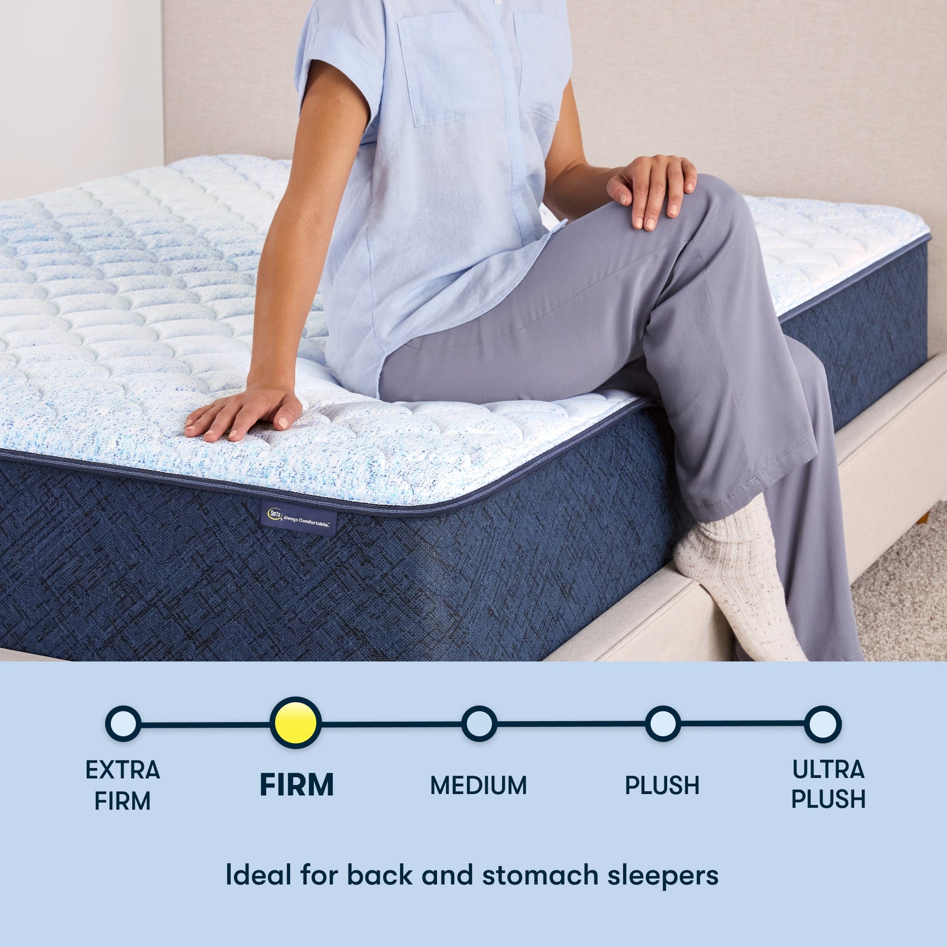 Woman sitting on the right of a 12 inch foam mattress sitting in a beige bedframe || feel: Foam (12" Profile)