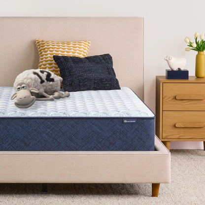 Sheep laying down on an 12 inch foam mattress sitting in a beige bedframe || feel: Foam (12" Profile)