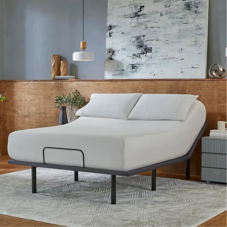 Baselogic Silver Adjustable Base with a white mattress sitting on top of it.
