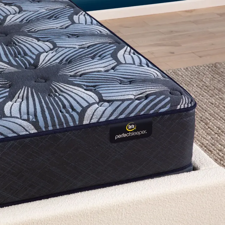 Corner view of the Serta Perfect Sleeper Sleep Excellence mattress in a bedroom | feel: Extra Firm