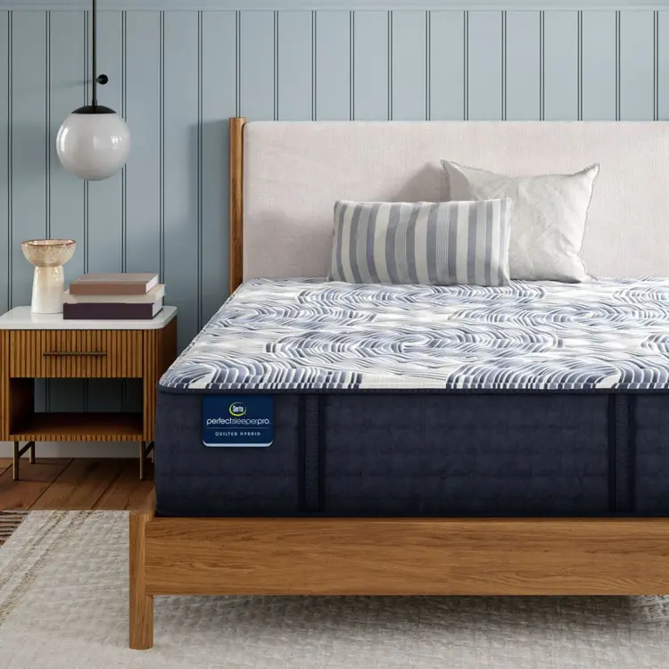 Perfect Sleeper Pro Geneva Firm mattress sitting in a brown bedframe || Level: Level 2 || Feel: Firm