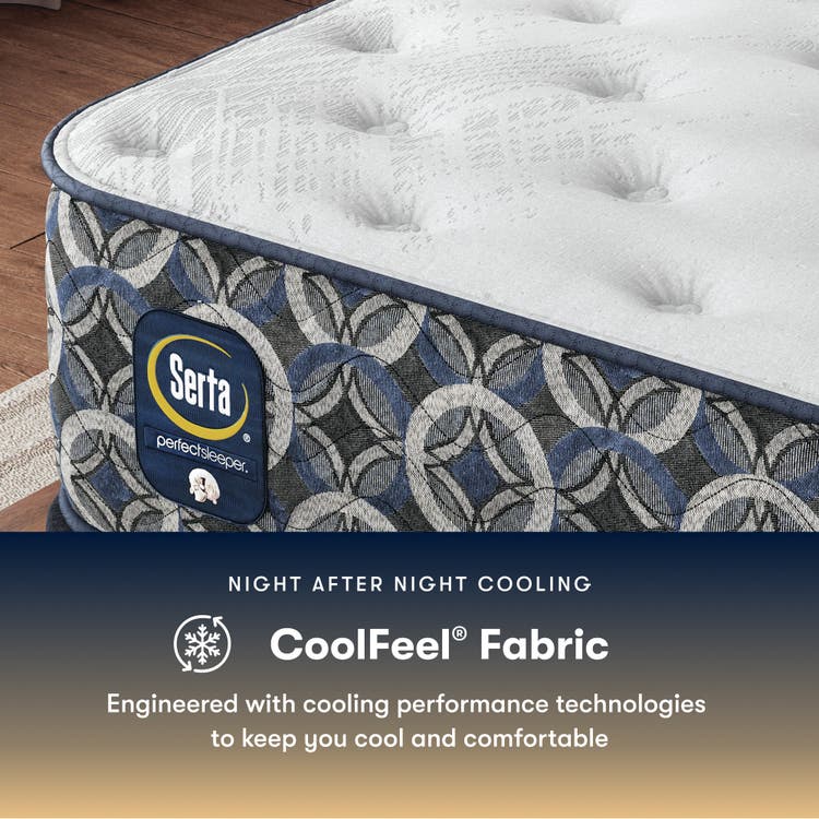 Serta perfect sleeper plush mattress with CoolFeel fabric feature on a wooden floor.