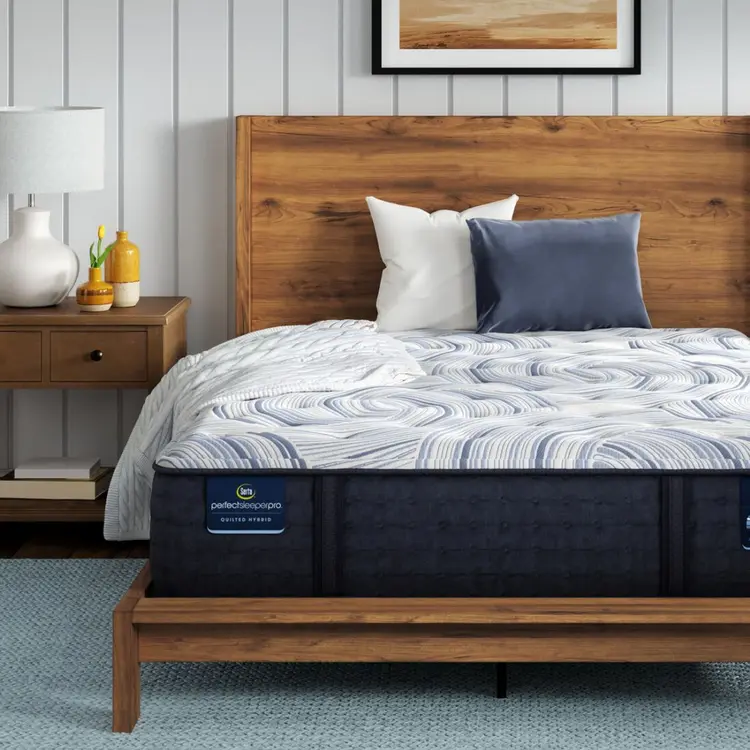 Perfect Sleeper Pro Kensington Medium mattress sitting in a brown bedframe || Level: Level 1 || Feel: Medium