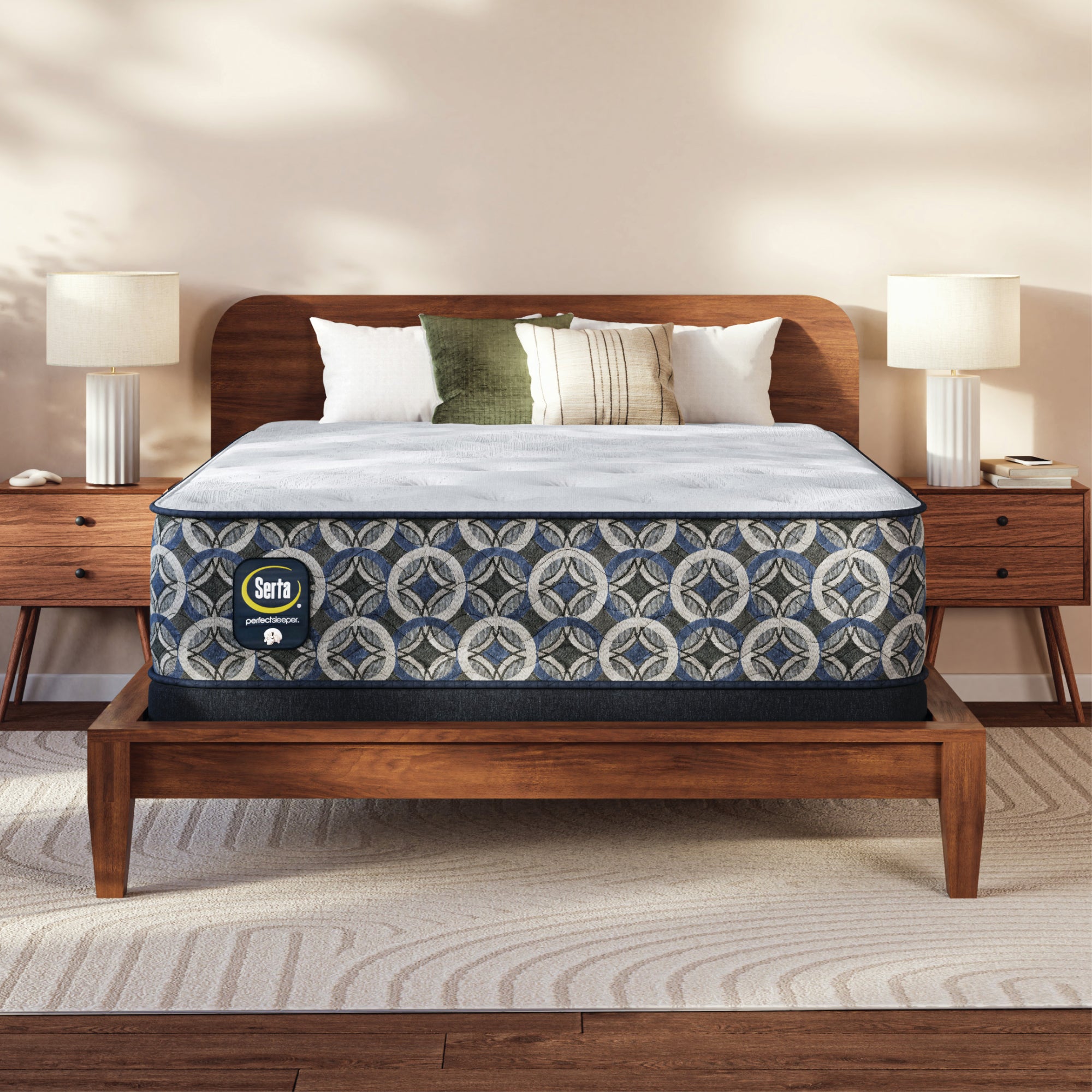 Serta perfect sleeper plush mattress on a wooden bed frame with pillows in a bedroom setting.