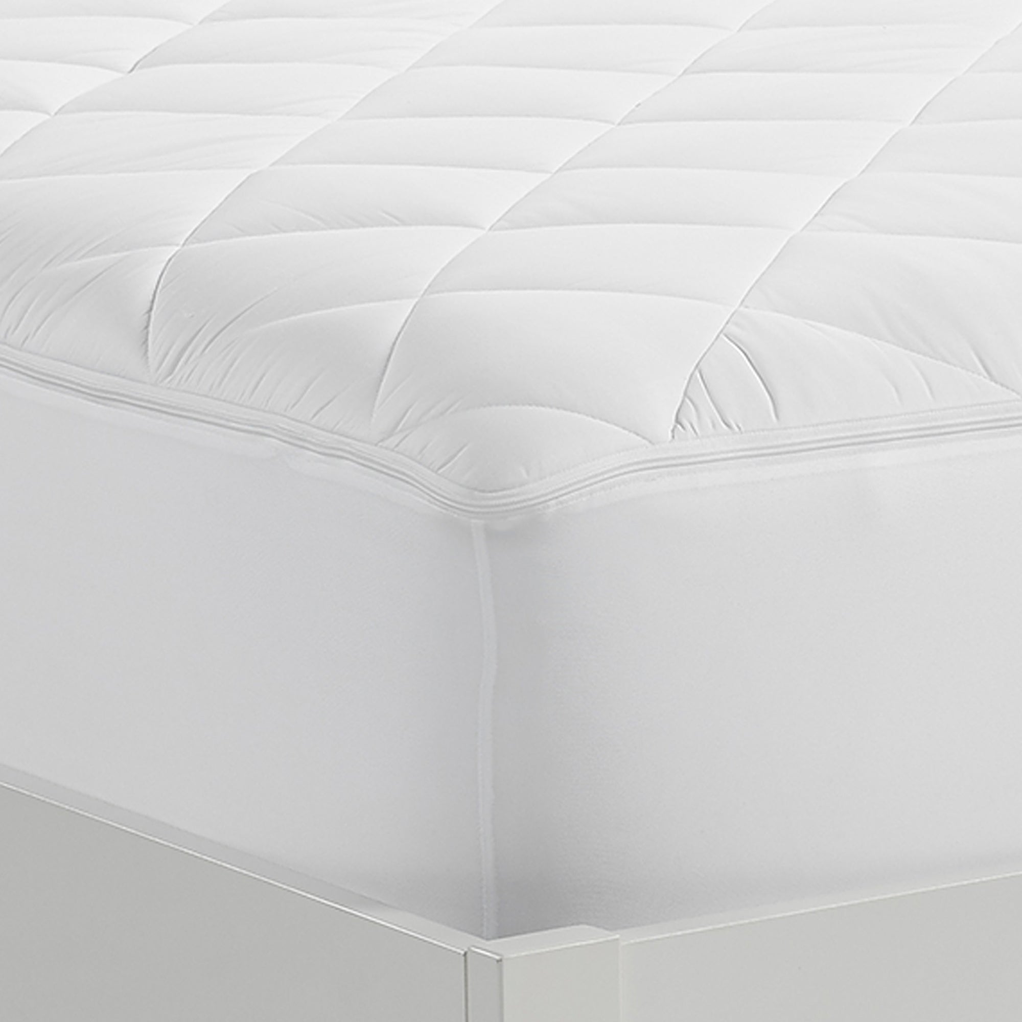 Serta Air Dry Extra Comfort Plus Mattress Pad on the corner of a mattress