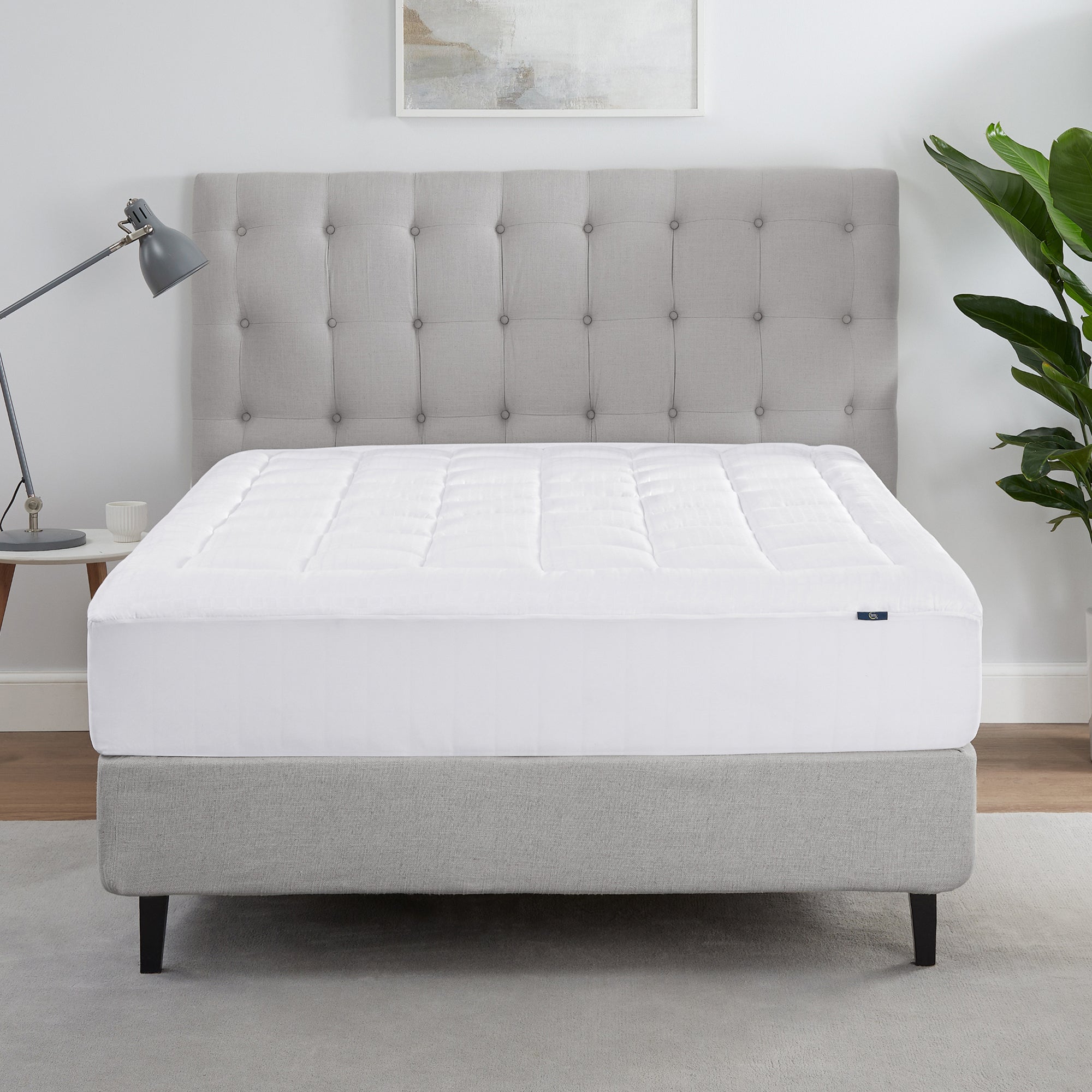 The Serta ComfortSure Mattress Pad on a bed