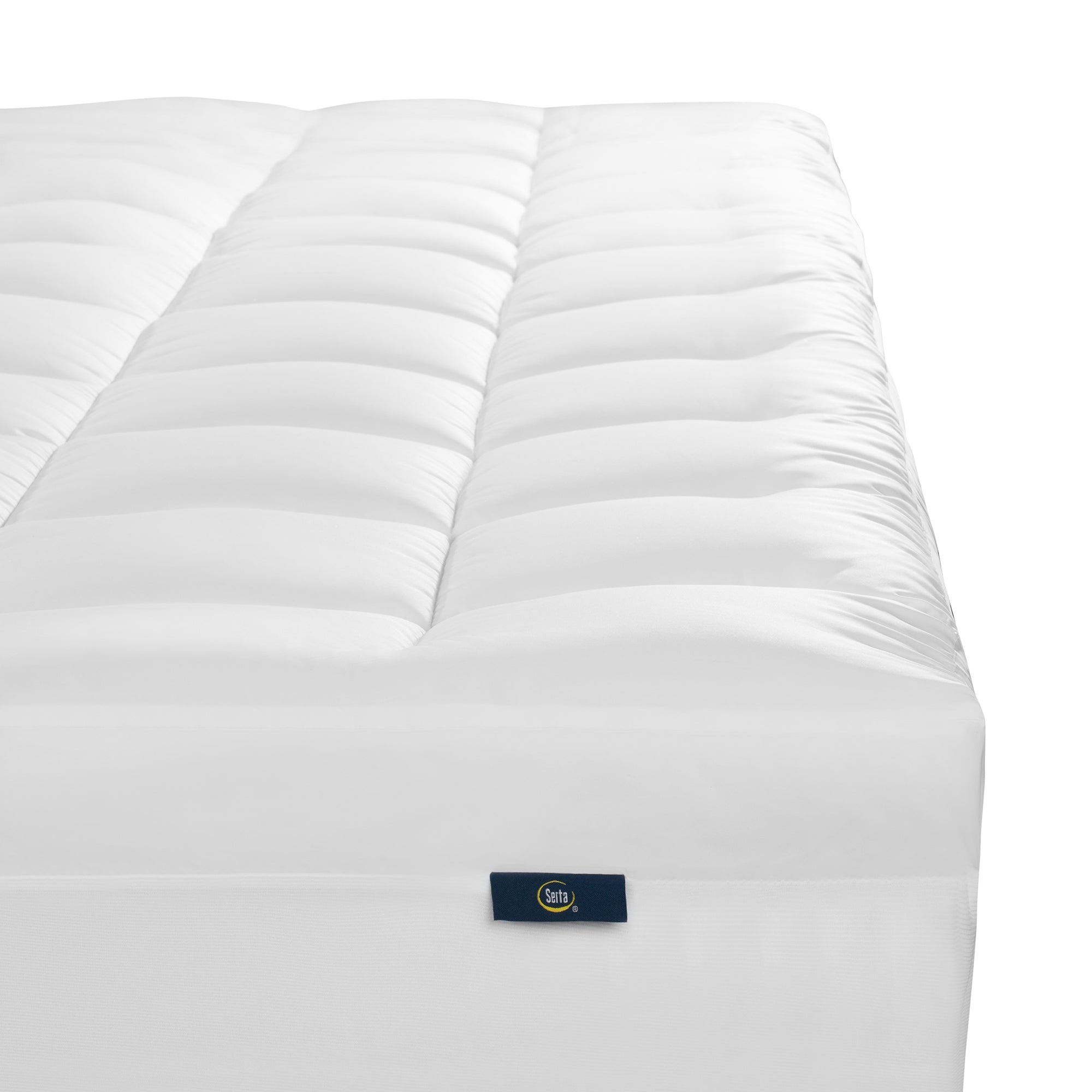Serta Memory Flex Mattress Topper closeup of on top of a mattress showing the foot of the bed only.